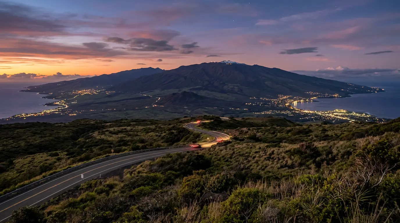 Saddle Road climbing from the Big Island's coast toward Mauna Kea's summit at dusk, with Waimea, Hilo, and Kona bases visible below