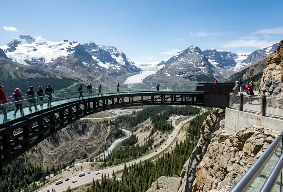 Glass-floored Glacier Skywalk cantilevered 280 meters above the Sunwapta Valley near Jasper National Park, the Athabasca Glacier and Icefields Parkway visible in the distance under a clear sky, one of the best things to do in Jasper beyond stargazing
